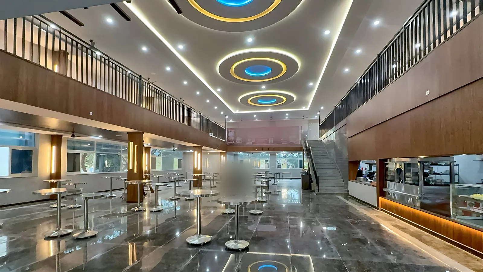 Food court seating hall with ringed ceiling and service counters