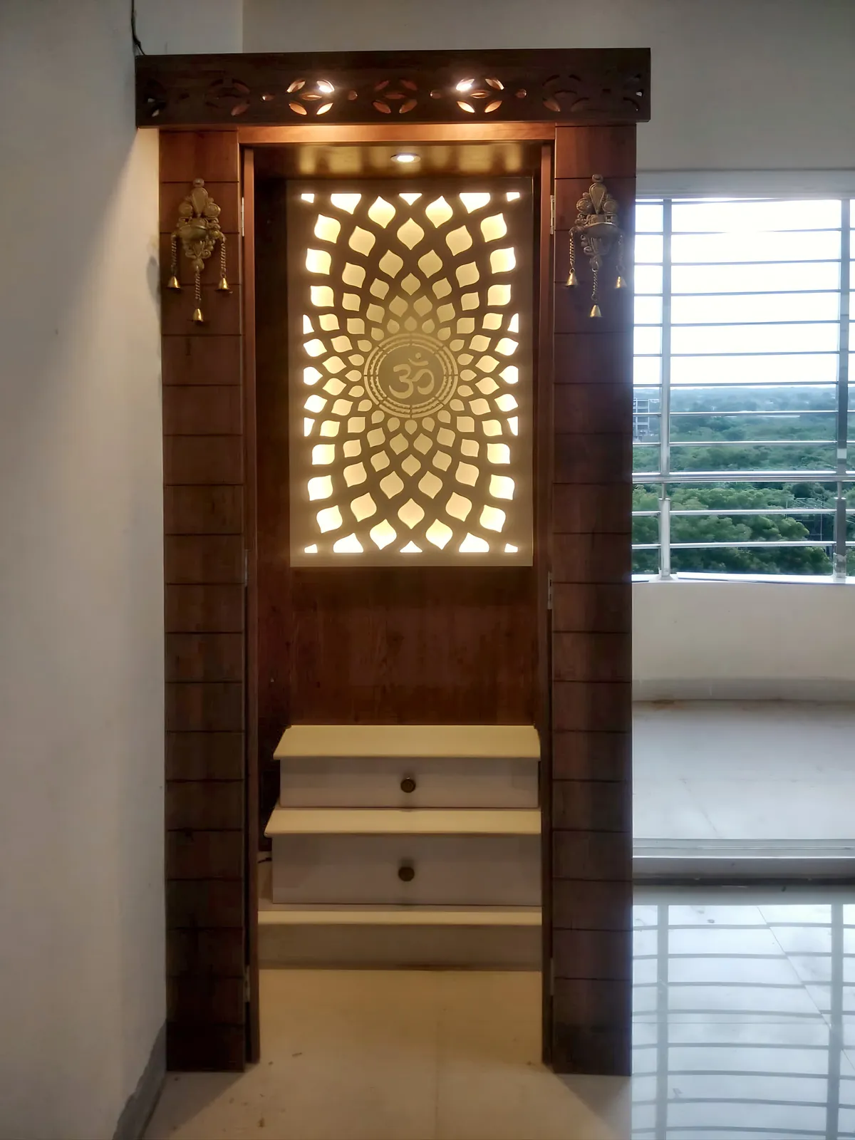 Wooden pooja unit with backlit jaali and steps